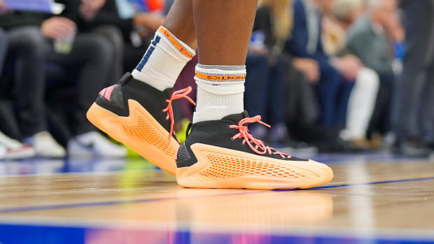 Minnesota Timberwolves guard Anthony Edwards' orange and black adidas sneakers.